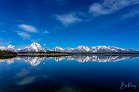 Glass calm reflection of the Tetons